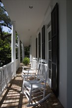 Wooden rocking chairs on front porch