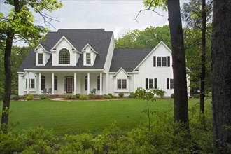 Exterior of a single family home with lawn in yard