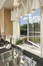 Sinks on countertop by window in kitchen