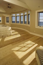 Master bedroom with ocean views and White oak hardwood floors