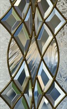 Detail frosted and bevel glass in door