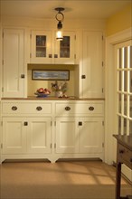 Kitchen pantry area with cabinets