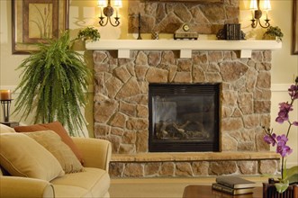 Close up of traditional living room with stone fireplace