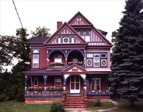 Front exterior view of a colorful Queen Anne Victorian Home