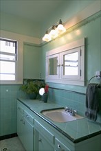 Interior shot of aquamarine bathroom