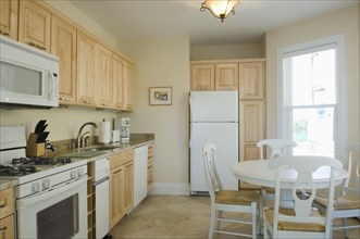 Traditional kitchen with light colored cabinets