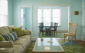 Blue and green living room with dining nook