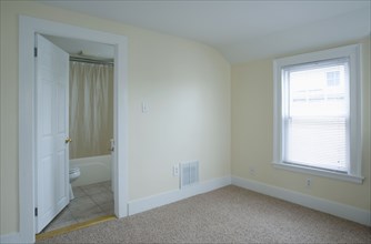 Empty room in apartment with carpeting