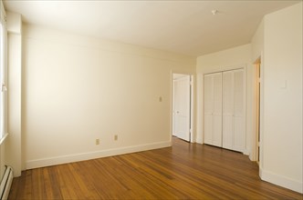 Empty room in apartment with hardwood floor