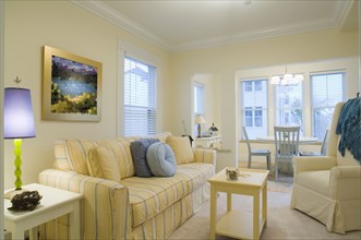 Yellow living room with dining nook