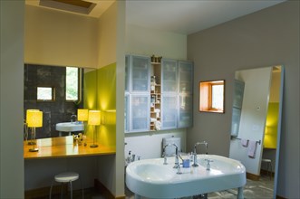 Vanity and double sink in modern bathroom