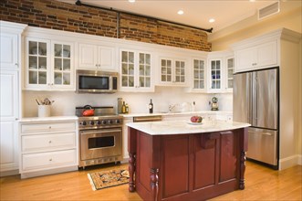 Traditional kitchen with red island