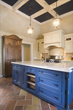 Traditional kitchen with blue island