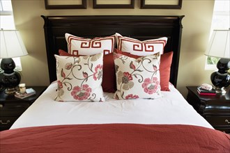 Floral throw pillows on bed