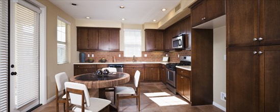 Kitchen with brown cabinets at home