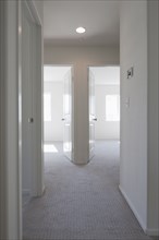 Empty room with open doors and hallway at home