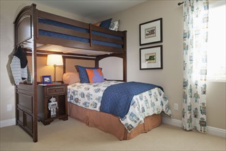 Bunk bed with study desk in kids bedroom at home