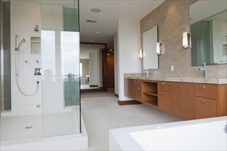Contemporary bathroom with glass shower at home