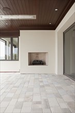 Covered patio with fireplace at Newport Beach