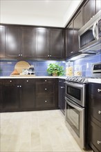 Kitchen with brown cabinets at home