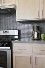 Cabinets and stove in domestic kitchen