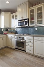 Cabinets and appliances in domestic kitchen