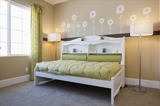 Interior of child's bed with floor lamps