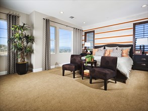 Interior of contemporary bedroom with seating furniture