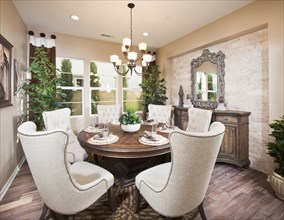 Wingback chairs at dining table in house