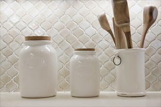 Close-up of jars on shelf at home