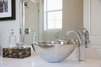 Close-up of stainless steel sink in the bathroom at home