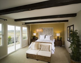 Wooden ceiling beams in bedroom