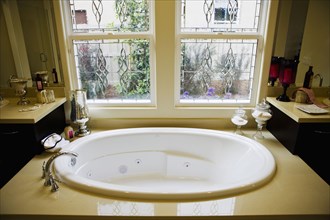 Contemporary hot tub beneath windows