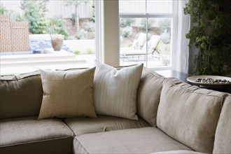 Sectional sofa in front of windows