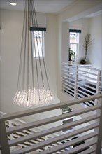 Hanging light bulbs of contemporary chandelier