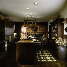 Interior of a contemporary kitchen with arranged cooking island