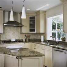 Granite counters in kitchen with triangle work area