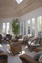 Sunroom with brown wicker furniture