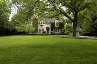 Ivy covered French Normandy style home