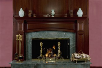 Cherry wood mantel and green marble surround