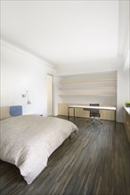 Modern bedroom with hardwood floors