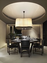 Contemporary dining room with circular dining table