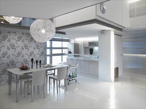 Modern dining area outside of kitchen