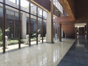 Modern marble hallway along side water