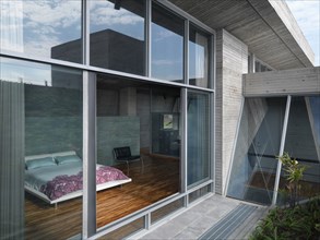View through window into modern bedroom
