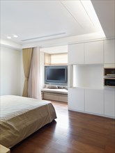 Bedroom with hardwood floors in modern home