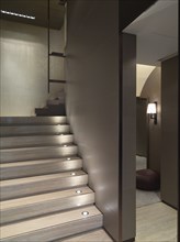Wooden staircase with built in recessed lights