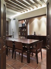Opening wooden doors leading to dining room