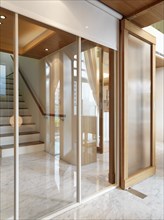 View through interior windows to modern staircase