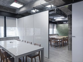 Modern conference room with white board walls